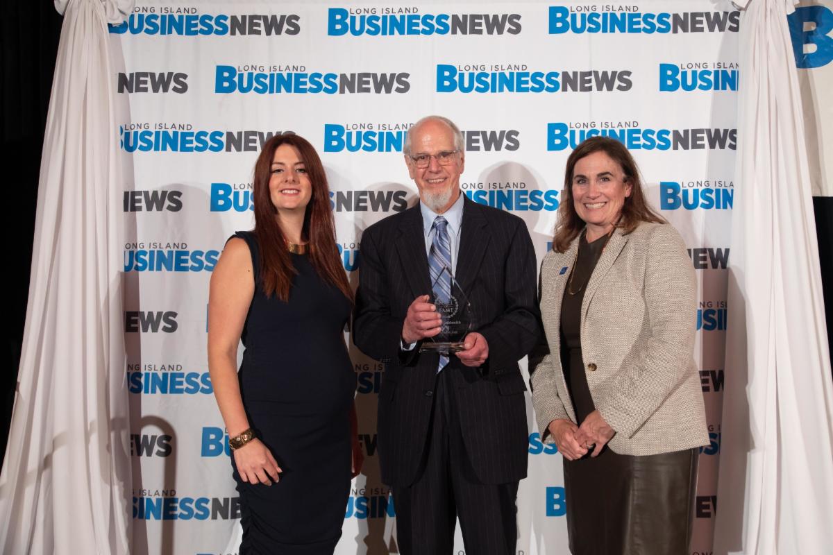 Photo of Peter Goldsmith with LI Business Hall of Fame Award