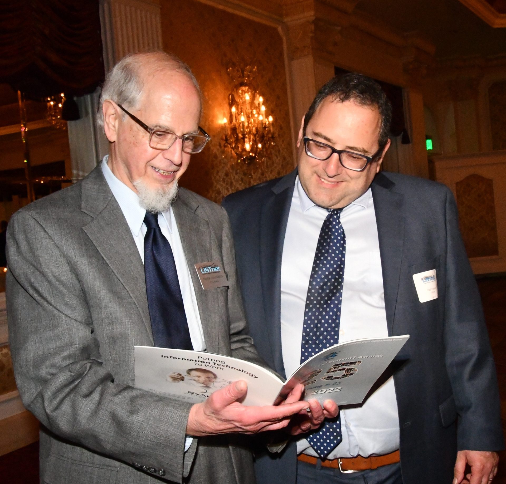Peter Goldsmith and Paul Trapani looking at LISA 2022 Journal